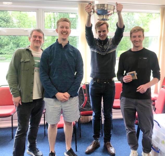 4 members of the 5-man winning team
